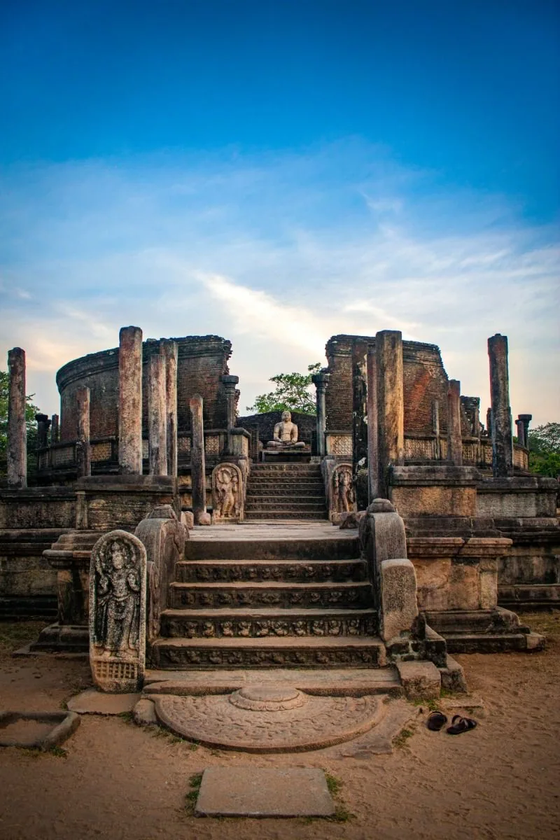 Ancient stone ruins settle into warm evening light in Sri Lanka's cultural triangle.